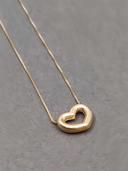 COLLIER en or jaune 750° accompagnée d'un...