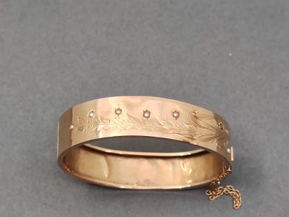 BRACELET jonc en or jaune 750° ouvrant à...
