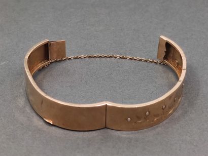 BRACELET jonc en or jaune 750° ouvrant à...