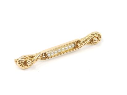 LOT d'or 750° comprenant :

Deux broches...