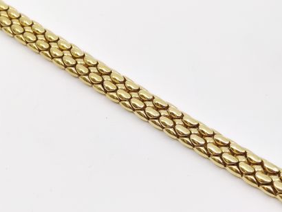 BRACELET en or jaune 750°, orné de rubis...