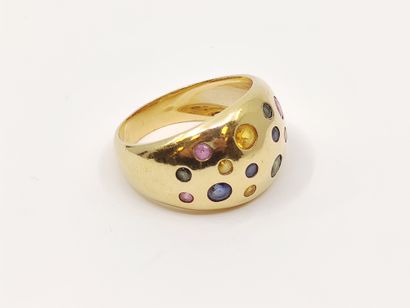 BAGUE jonc en or 750°, pavée d'un tutti frutti...