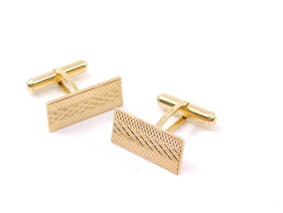 PAIRE de boutons de manchette en or jaune...