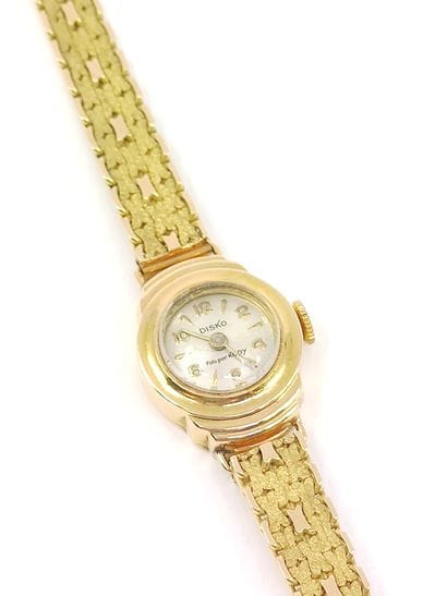 DISKO

Montre bracelet de dame en or jaune...