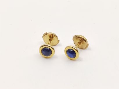 PAIRE de boutons d'oreilles en or jaune 750°...