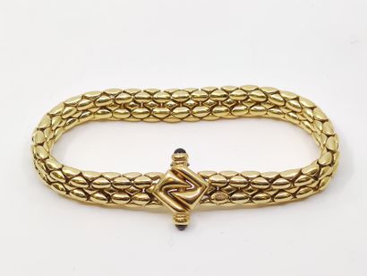 BRACELET en or jaune 750°, orné de rubis...