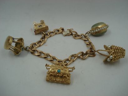 1 Bracelet Or 18kt et divers 87,28 g breloques...