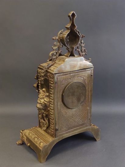 Gilt bronze clock in the Louis XV style decorated...