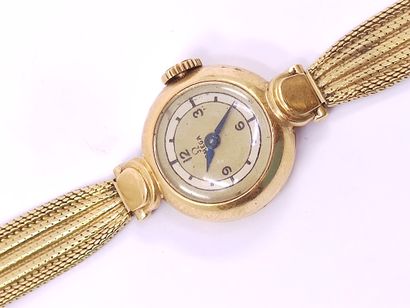 OMEGA 

Wristwatch in yellow gold 750°, round...