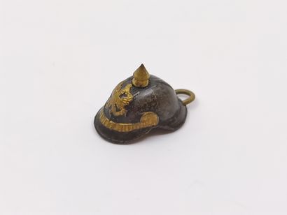 PENDANT representing a small helmet in m...