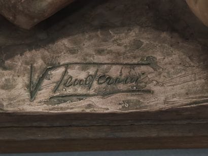 V TENDERINI?

terracotta sculpture on a wooden...