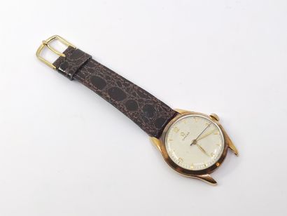 OMEGA 

Wristwatch, round case in yellow...