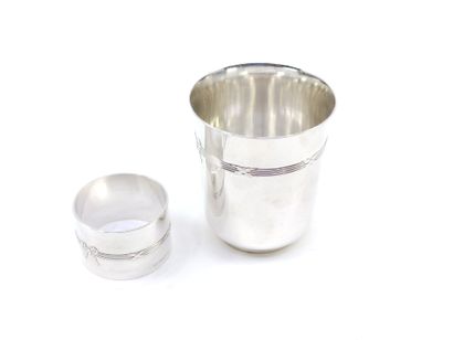 CHRISTOFLE

 a silver metal tumbler and a...