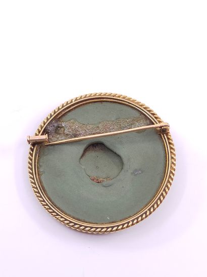 Cameo brooch with a lava stone representing...