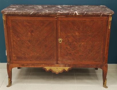 A rosewood veneer chest of drawers decorated...