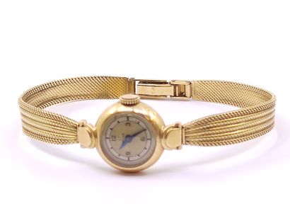 OMEGA 

Wristwatch in yellow gold 750°, round...