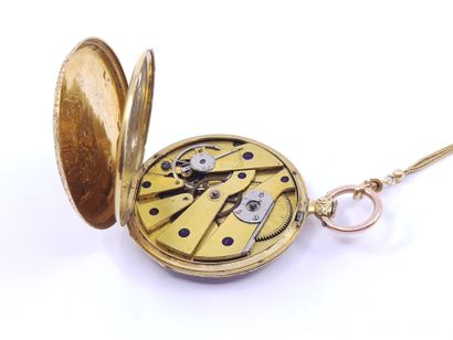 Pocket watch with its chain in gold 750

Double...