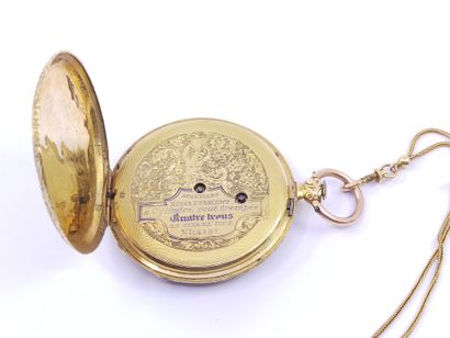 Pocket watch with its chain in gold 750

Double...