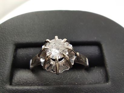 Solitaire ring in grey 750° set with a diamond...