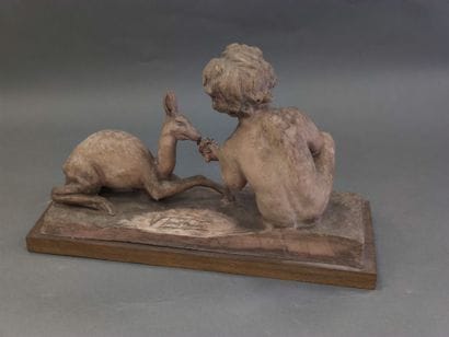 V TENDERINI?

terracotta sculpture on a wooden...
