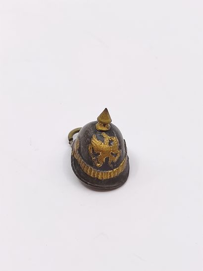 PENDANT representing a small helmet in m...