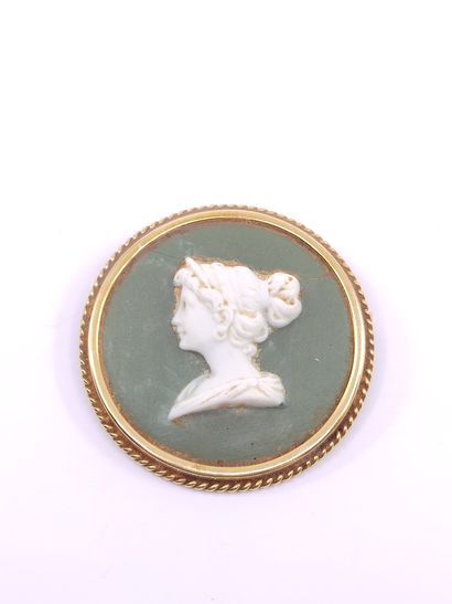 Cameo brooch with a lava stone representing...