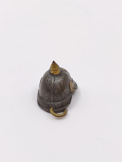 PENDANT representing a small helmet in m...