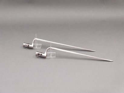 
Two bayonets with median ferrule. 




A.B.E....