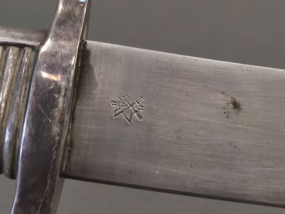 Saber lighter. 

Silver plated mounting....