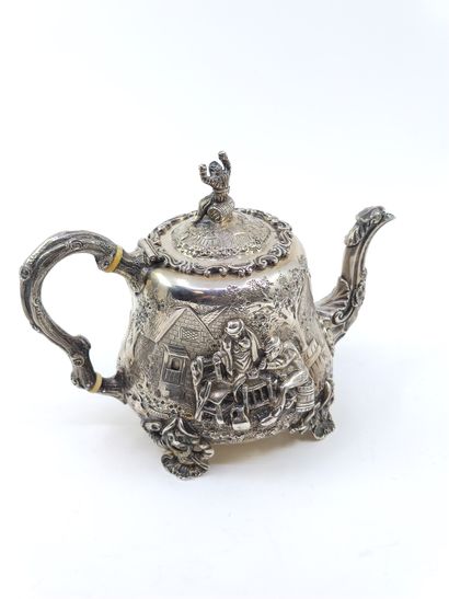 English silver tea service decorated with...