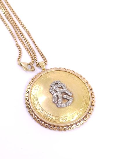 
750° yellow gold CHAIN with a circular pendant...