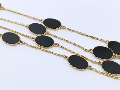 COLLIER sautoir en or jaune 750° ornée d'onyx

Poids...