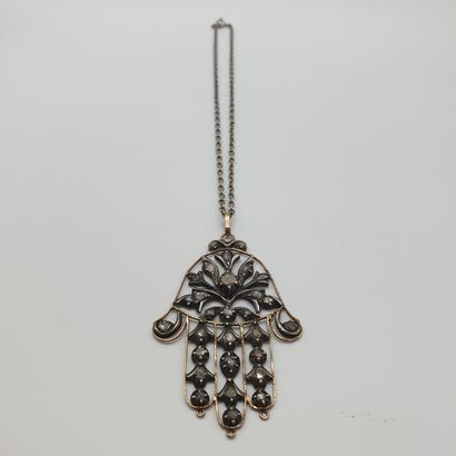 
PENDENTIF en or jaune 750° et argent représentant...