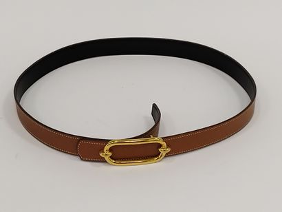 HERMES

Ceinture en cuir marron et noir réversible,...