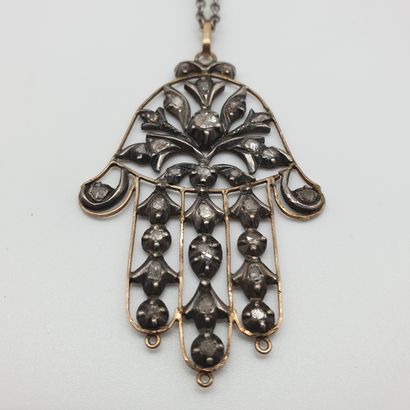 
PENDENTIF en or jaune 750° et argent représentant...