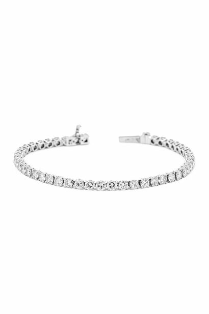 BRACELET rivière en or et platine ornée de...