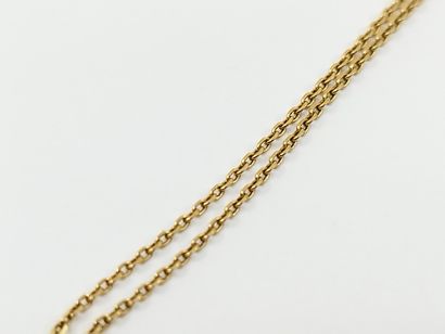 750° yellow gold CHAIN with a pendant adorned...