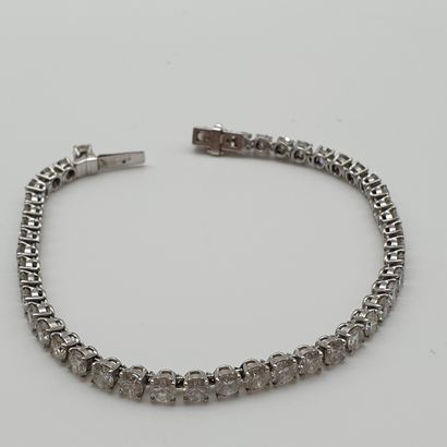 BRACELET rivière en or et platine ornée de...