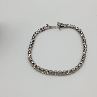 BRACELET rivière en or et platine ornée de...