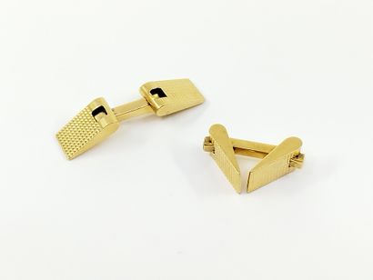 PAIRE de boutons de manchette en or jaune...