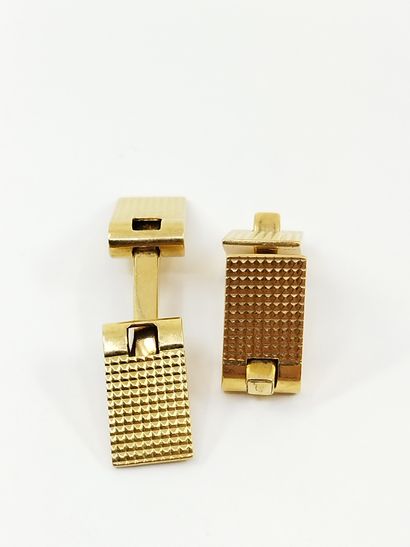 PAIRE de boutons de manchette en or jaune...