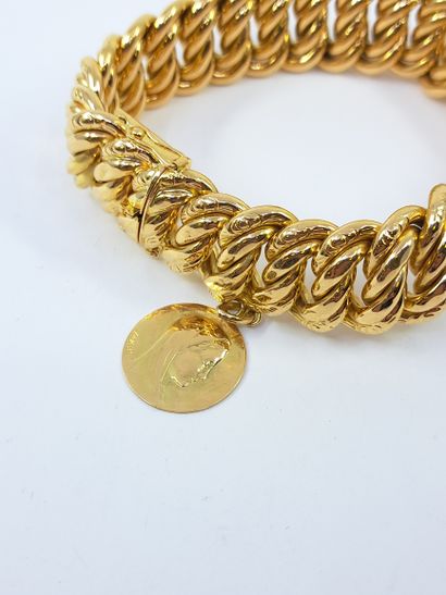 BRACELET in yellow gold 750° with a medal...