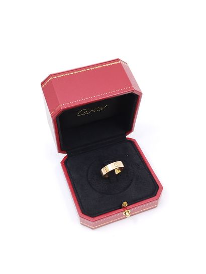 CARTIER LOVE
Bague en or rose 750° et trois...