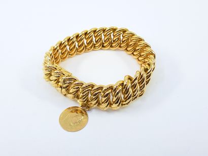BRACELET in yellow gold 750° with a medal...