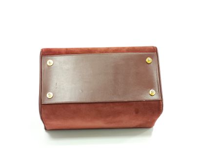 CARTIER must 
Sac diligence en cuir bordeaux...