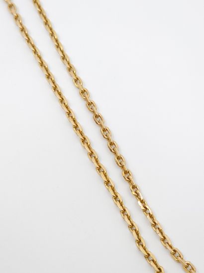 750° yellow gold CHAIN with a tiki pendant...