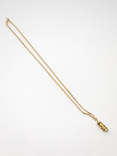 750° yellow gold CHAIN with a tiki pendant...