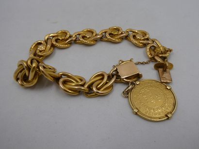 1 Bracelet Or 18kt orné d'une breloque 30,20g...