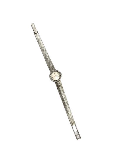 LIP 
Montre de dame en or 750° et platine,...