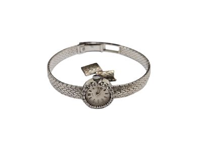 LIP 
Montre de dame en or 750° et platine,...